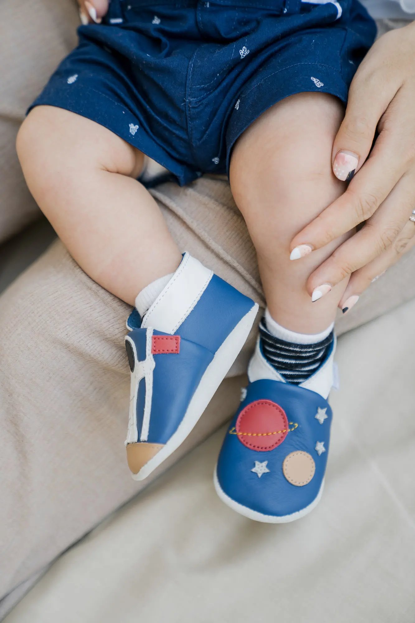 Close-up detail of a baby's feet during a family photography session at Samabe Bali Suites & Villas in Nusa Dua.