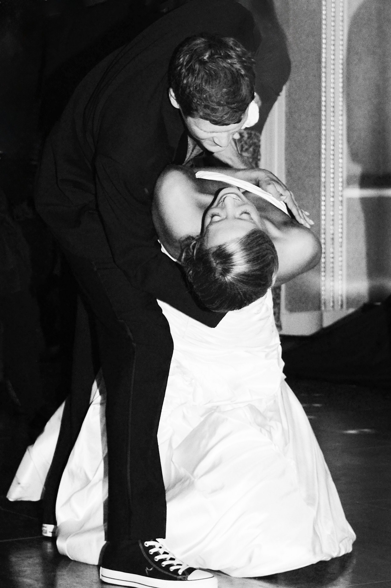 a bride and groom dancing at a wedding reception