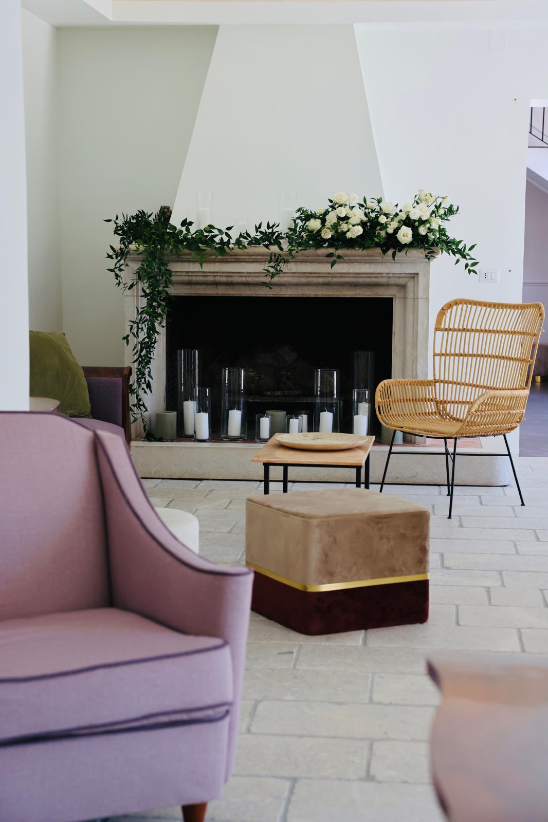 a living room with a fireplace and a chair
