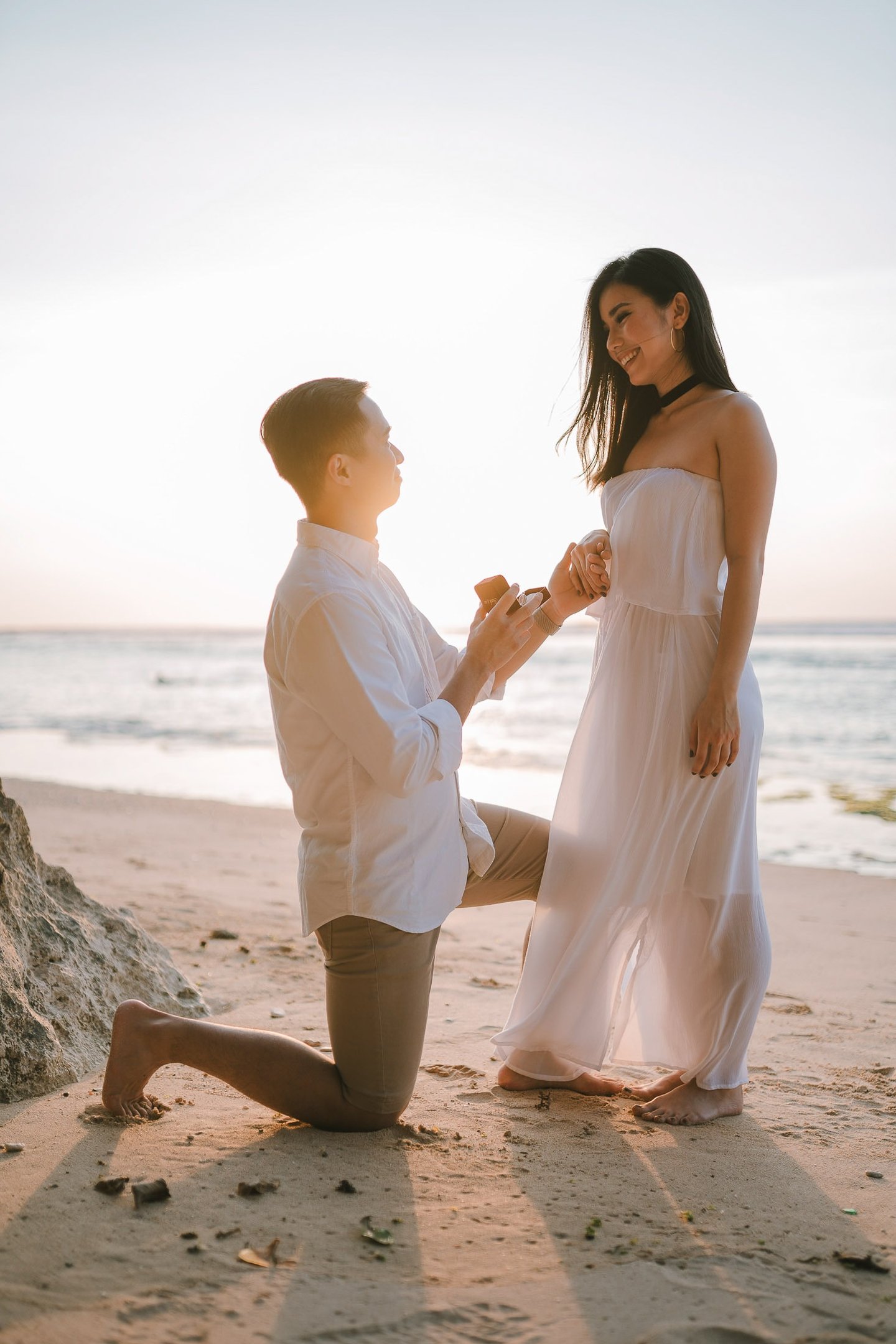 Beach proposal moment during a couple photography session at Anantara Uluwatu Bali Resort.
