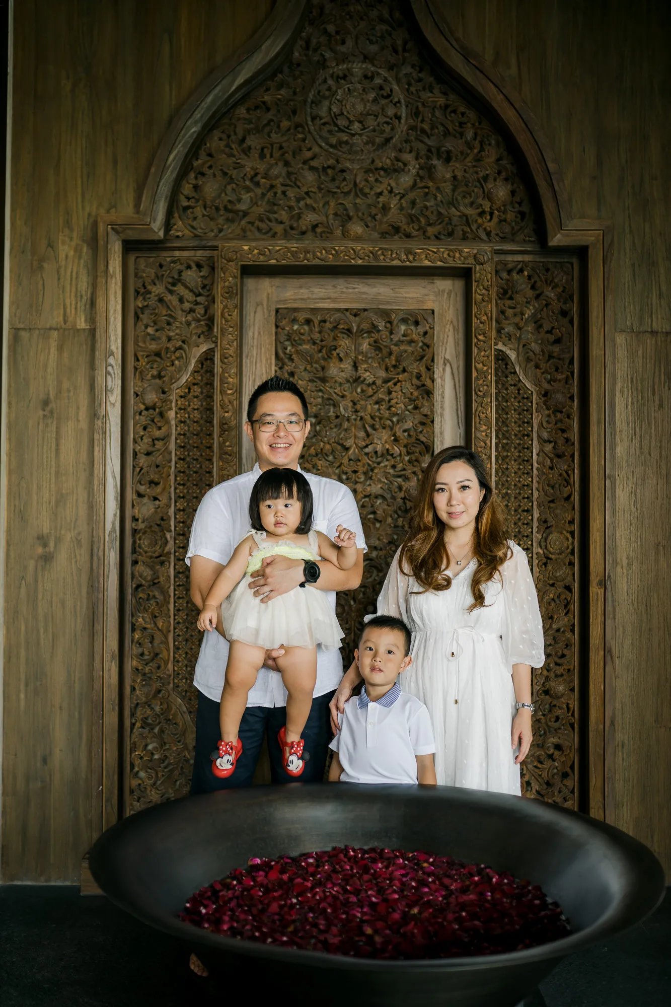 Family portrait inside The Grand Lobby at The Apurva Kempinski Bali, a luxury family photography location in Nusa Dua