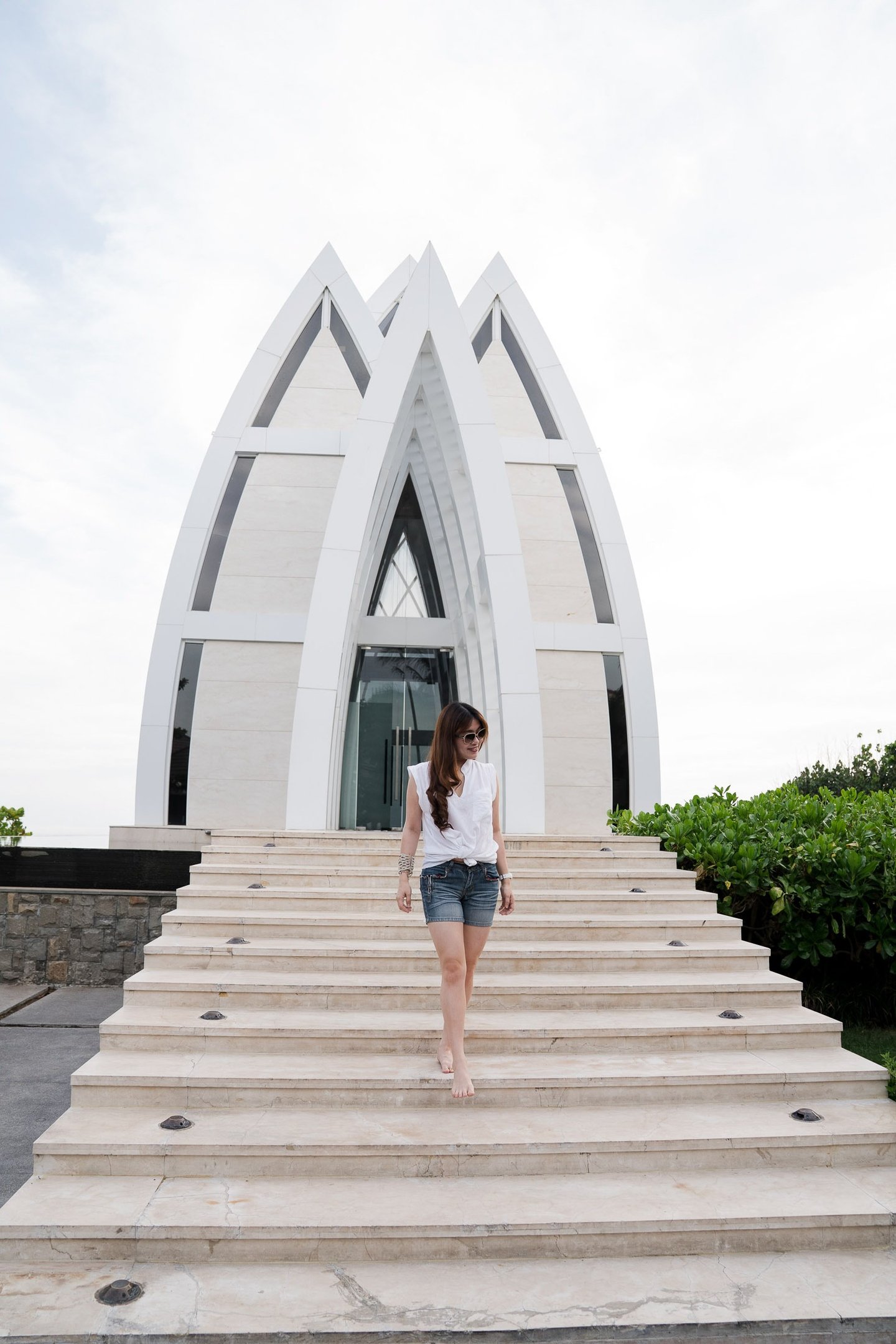 Family photography moment near the iconic chapel architecture at The Ritz-Carlton Bali in Nusa Dua