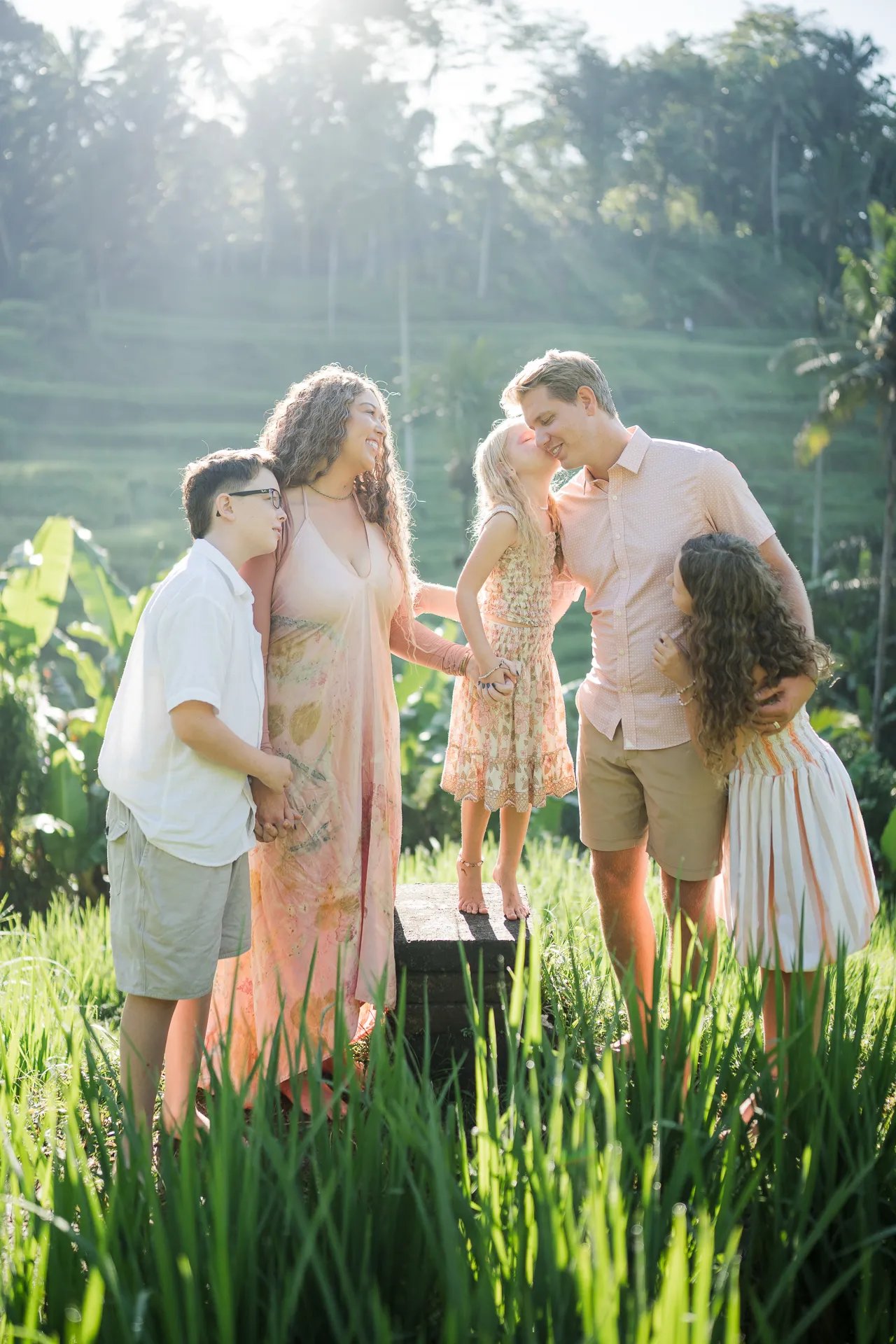 Couple portrait in the rice fields during a family photography session in Tegalalang Bali