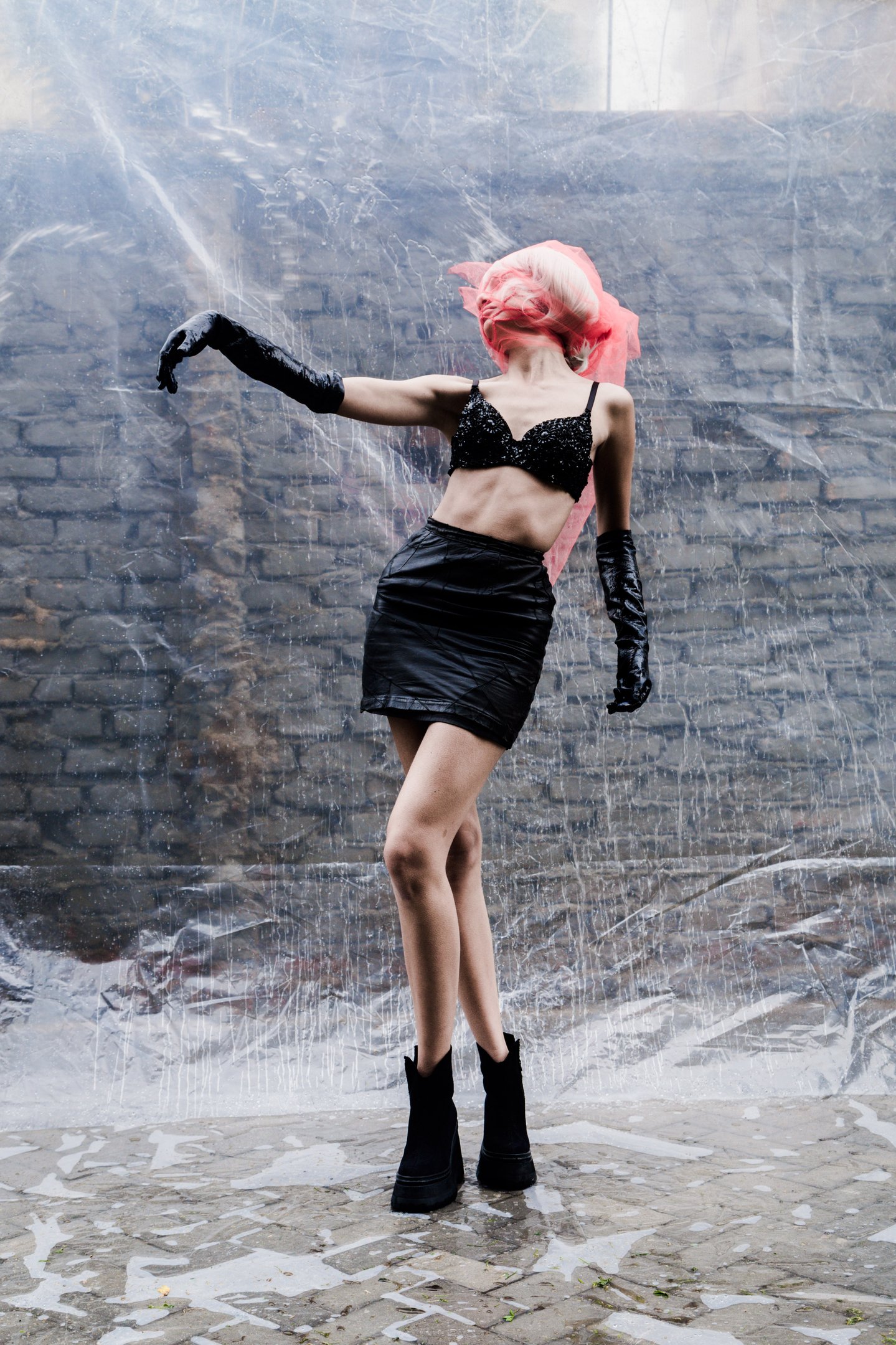 a woman in a black dress and black boots