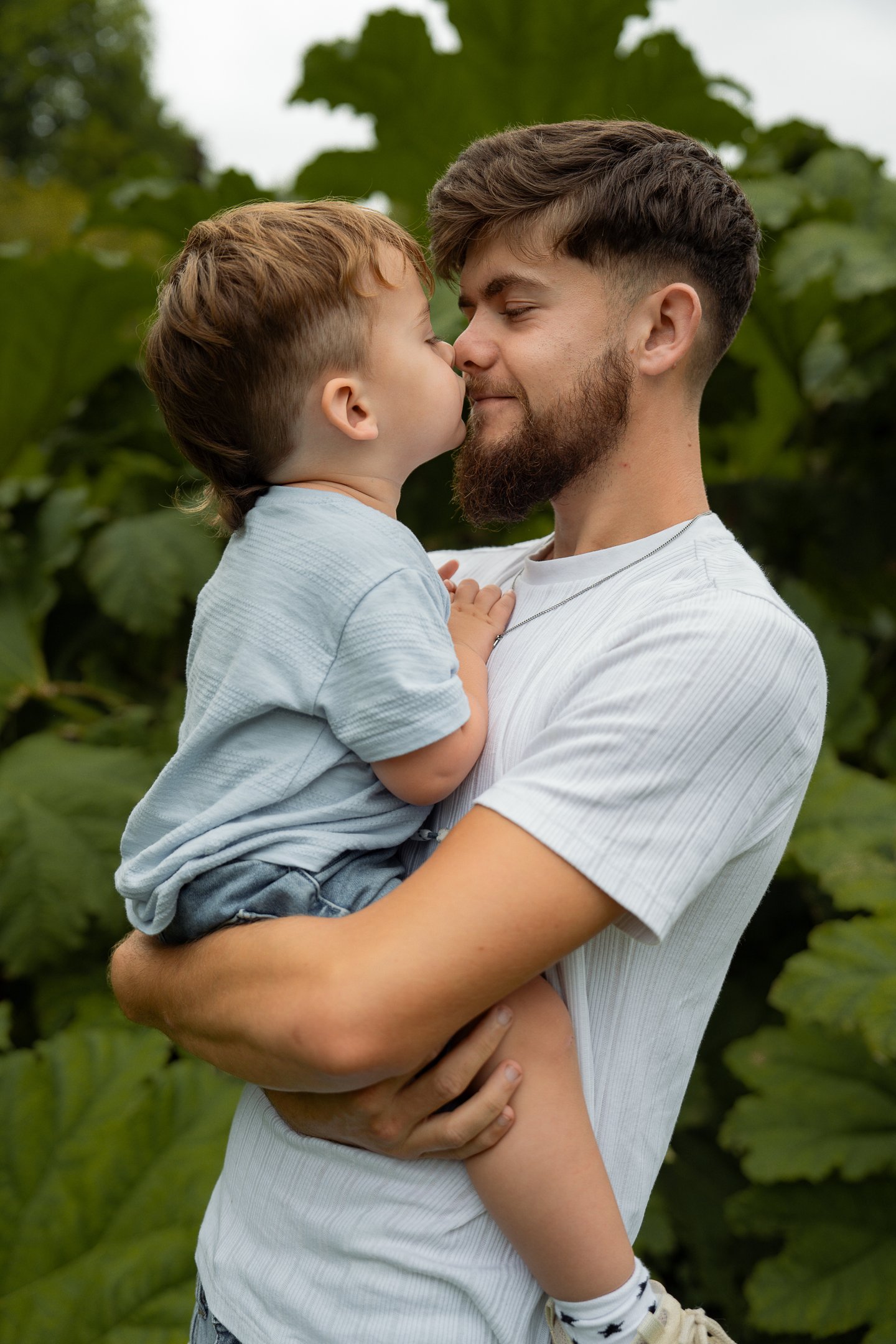 Father with son nose to nose photograph