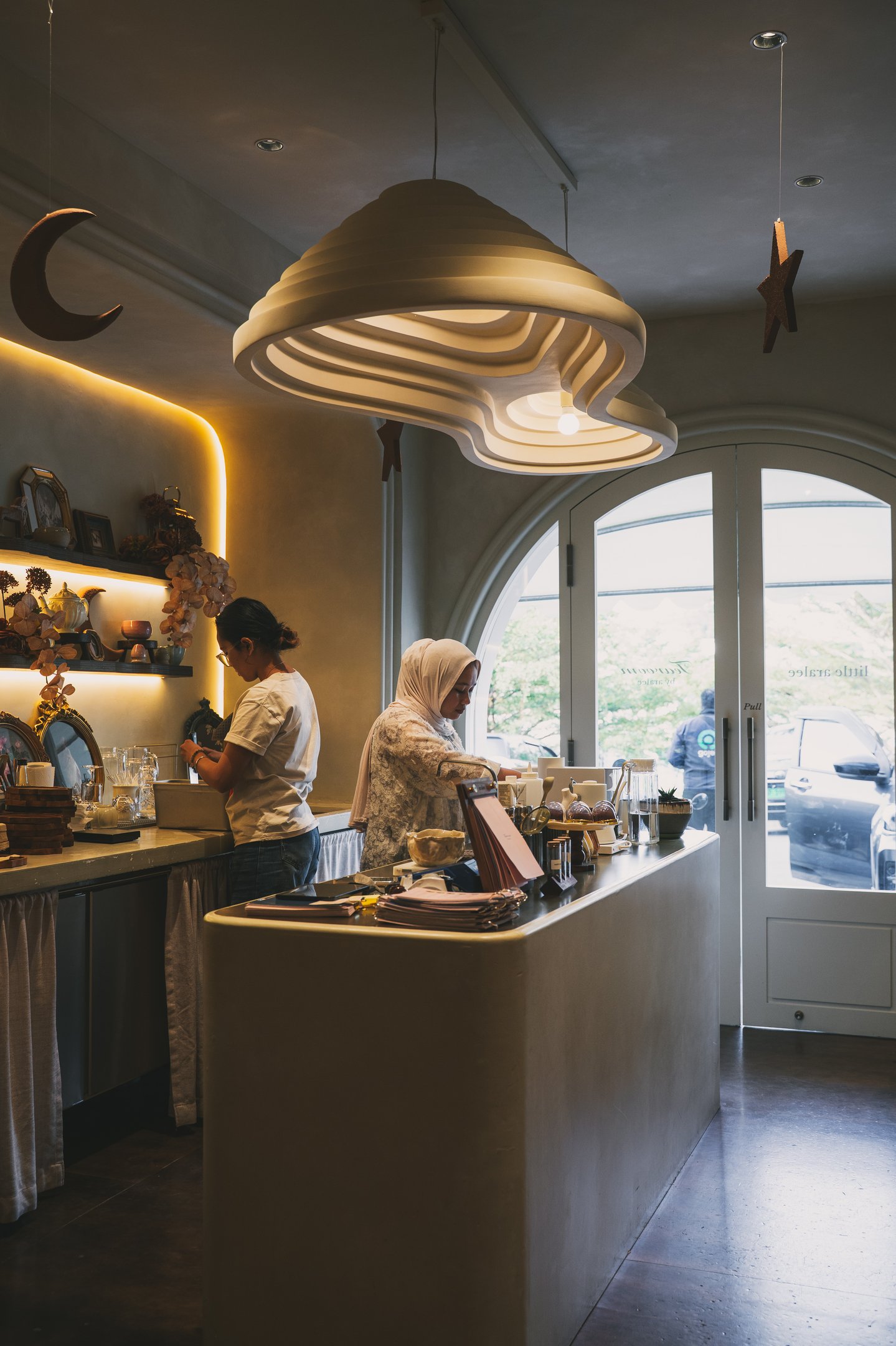 Staff preparing drinks at Tearoom by Aralee Batam