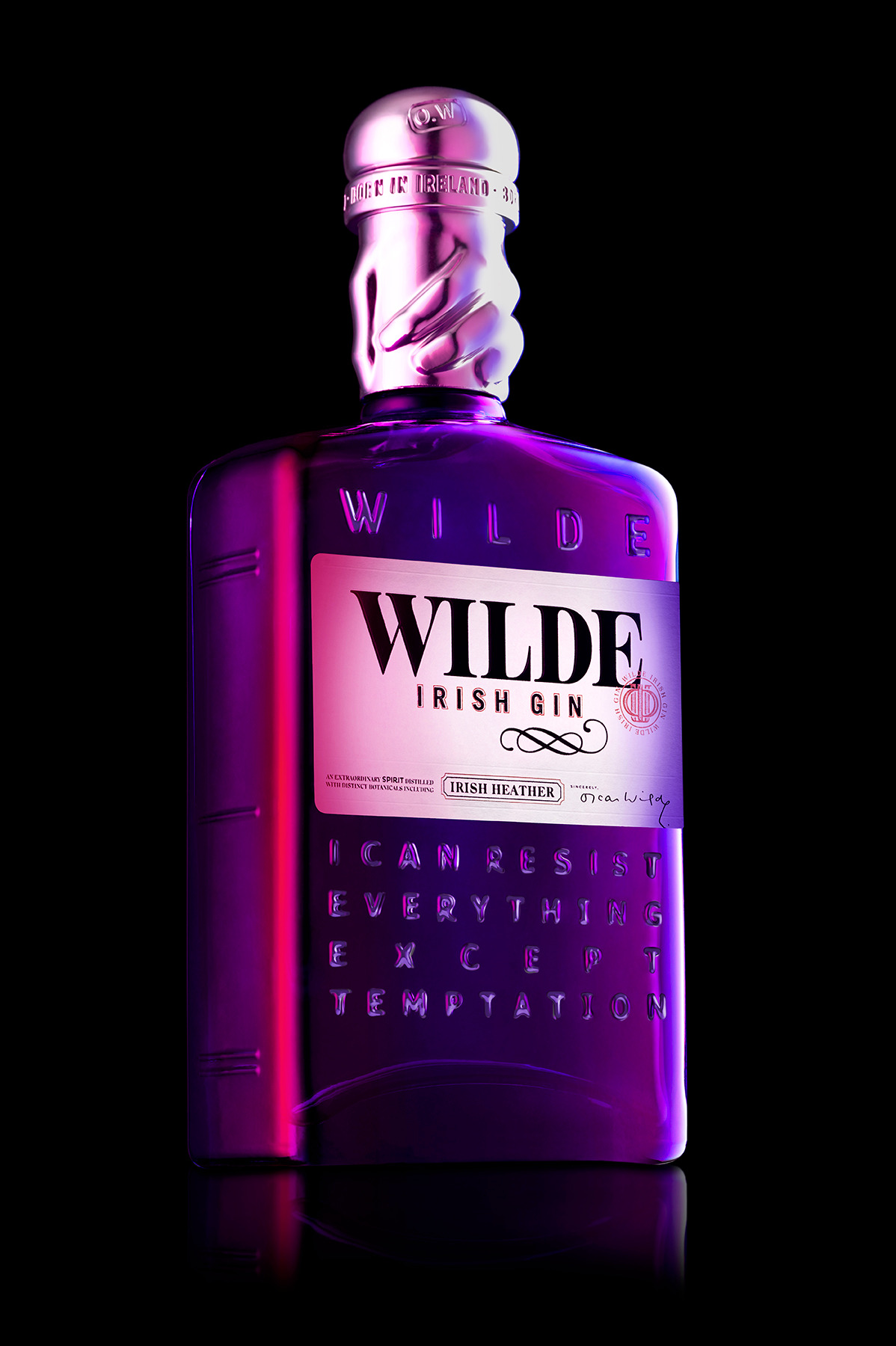 Purple and pink bottle of Wild Irish Gin on a black background