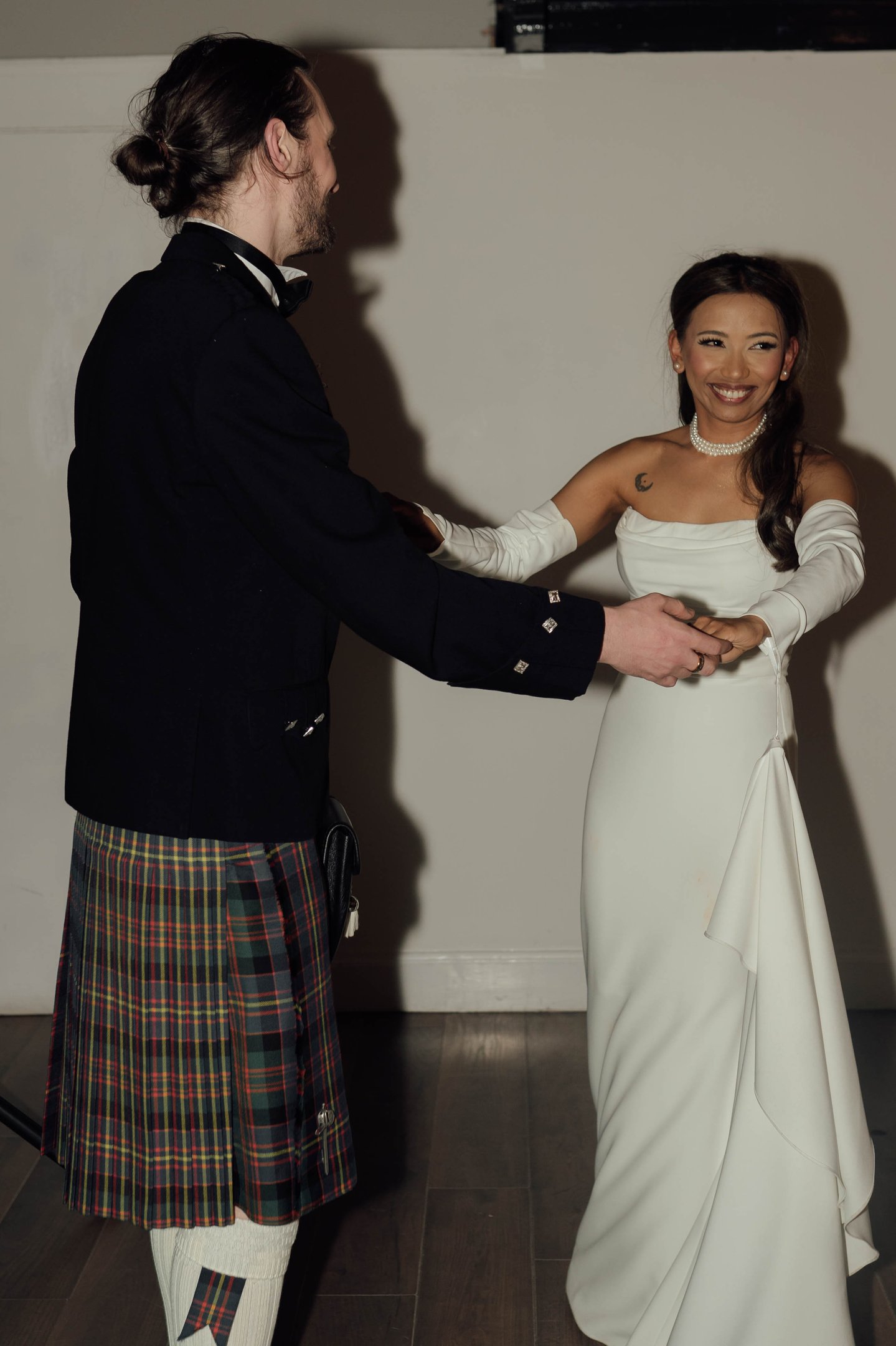 a man in a kiltrum kilt and a woman in a kilt