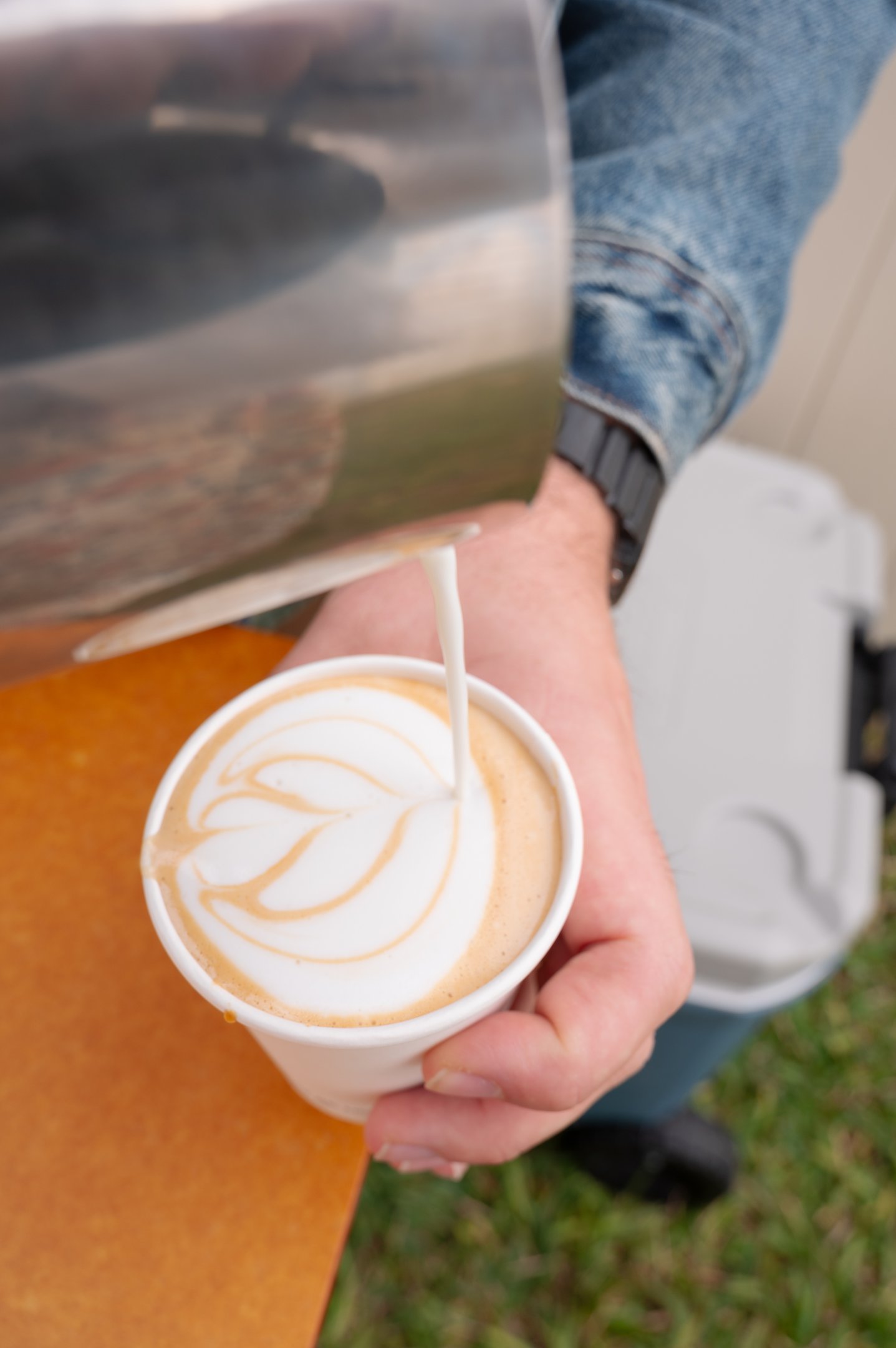 Latte art being poured