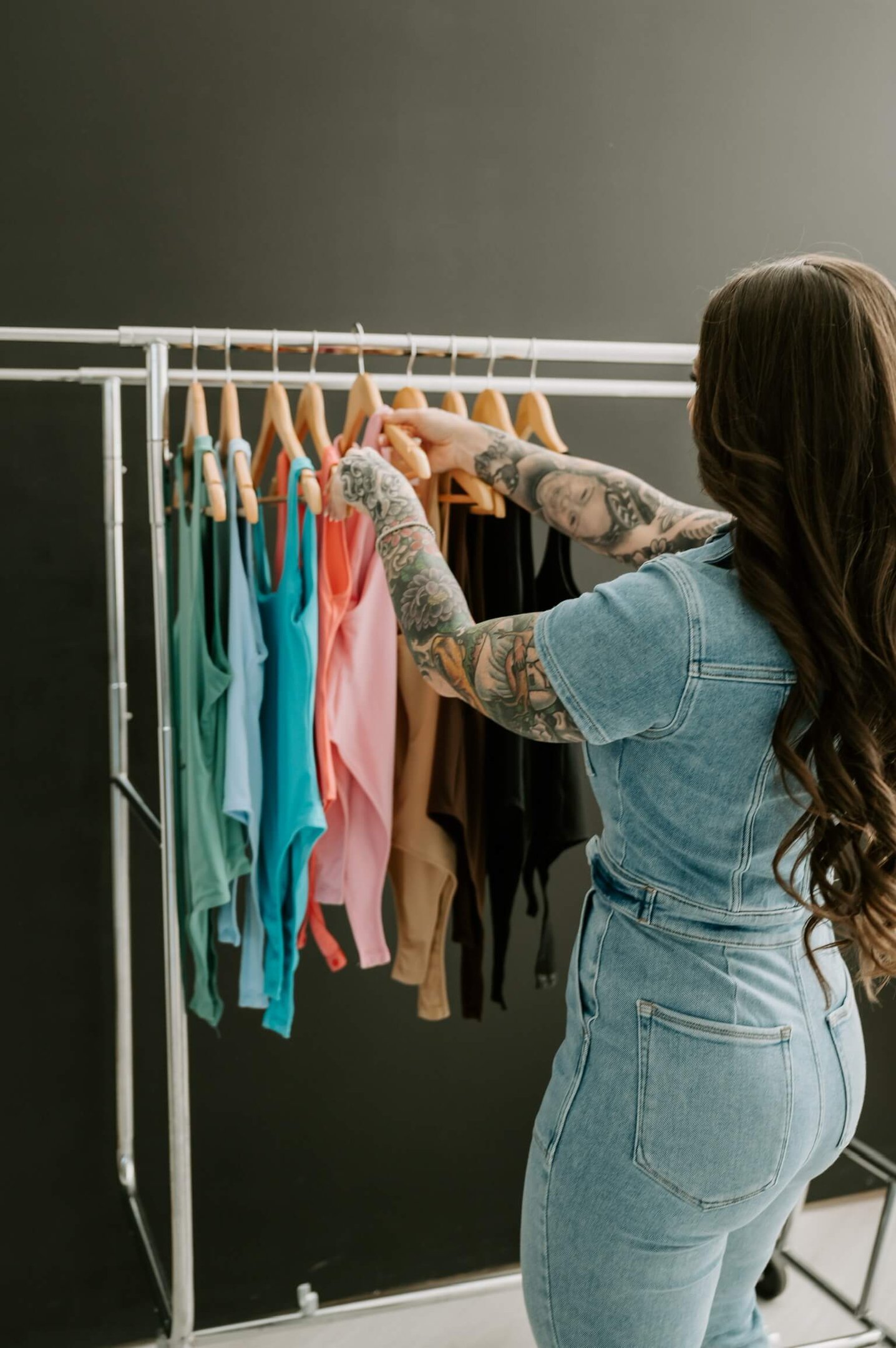 Professional home organizer decluttering and organizing clothing in a Dallas TX home