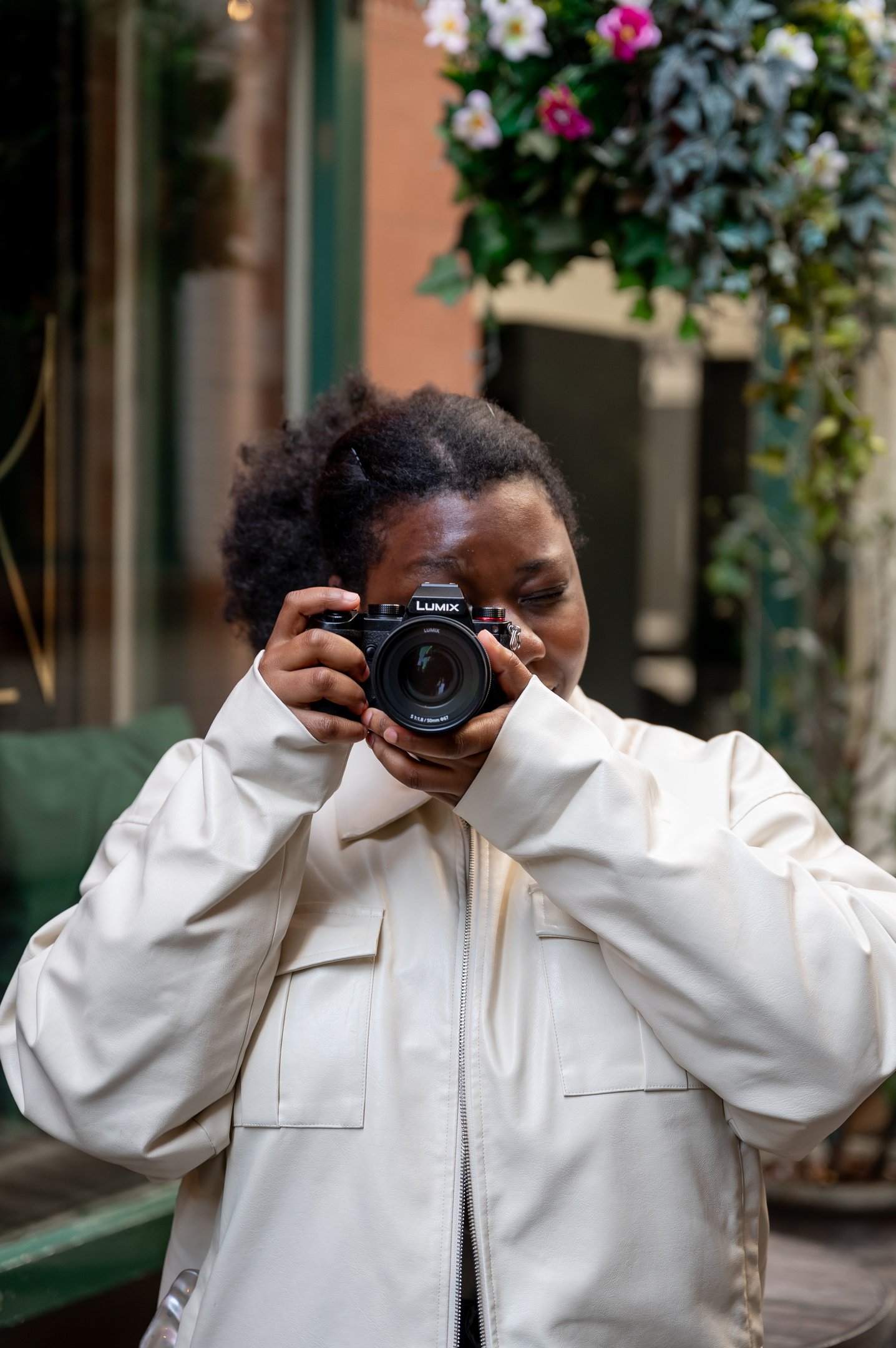 a black woman taking a self portrait of herself