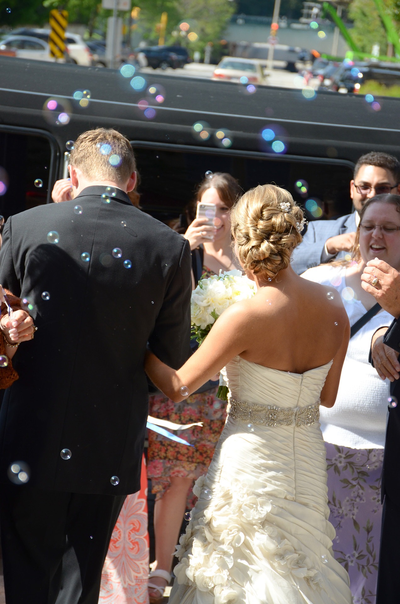 a bride and groom are walking down the aisle