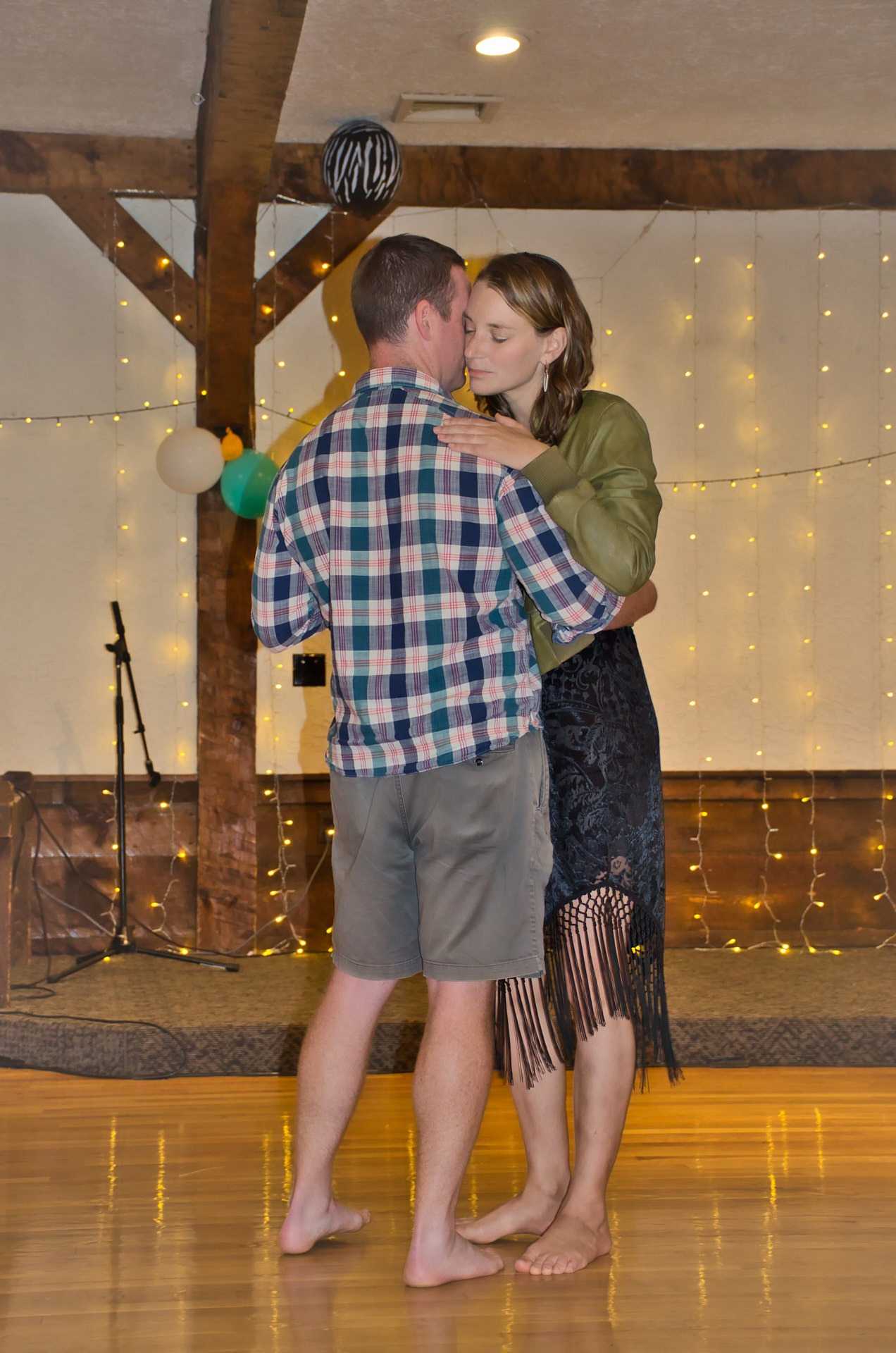 a man and woman dancing at a dance floor