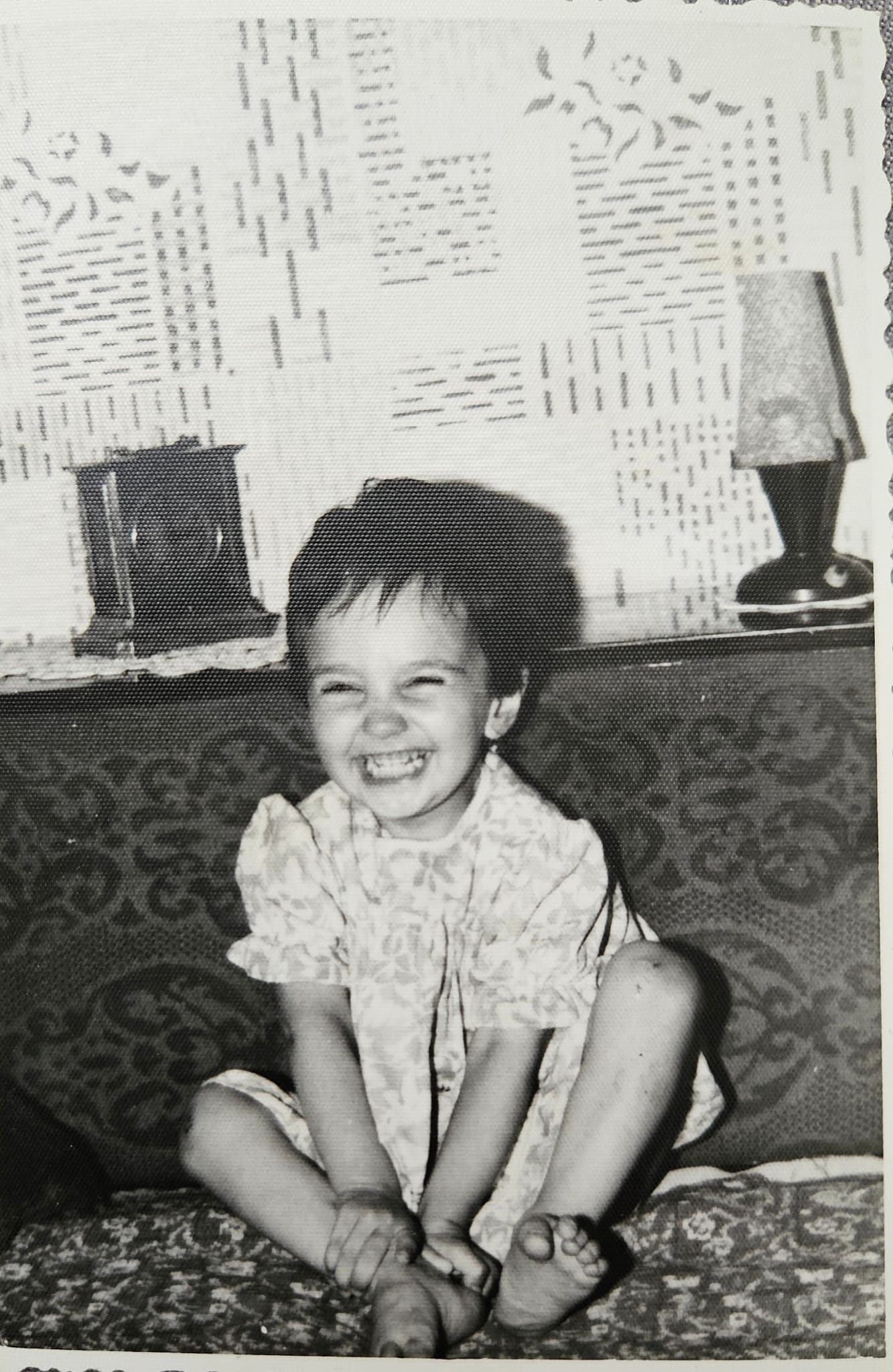 a toddler laughing towards the camera
