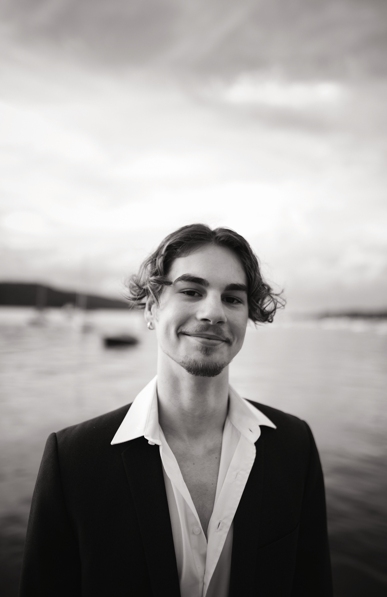a man in a suit and white shirt