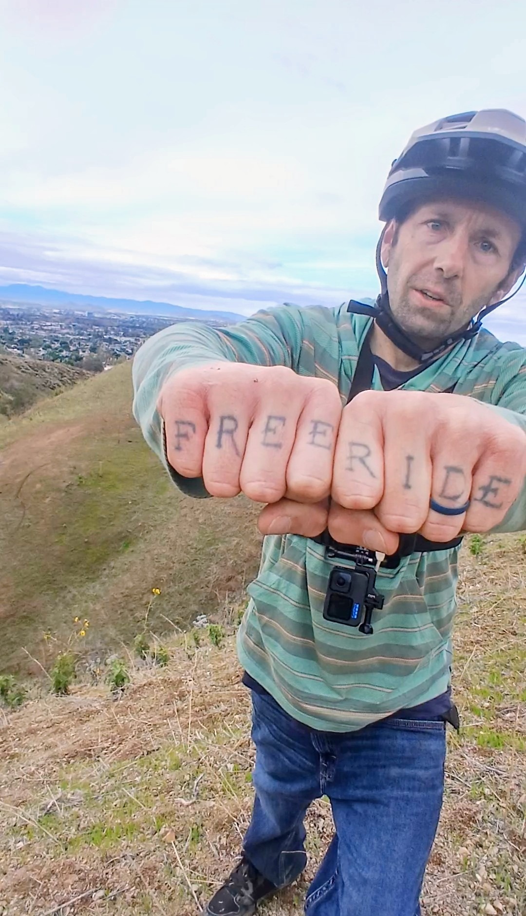 mountain biker with free ride tattoo 