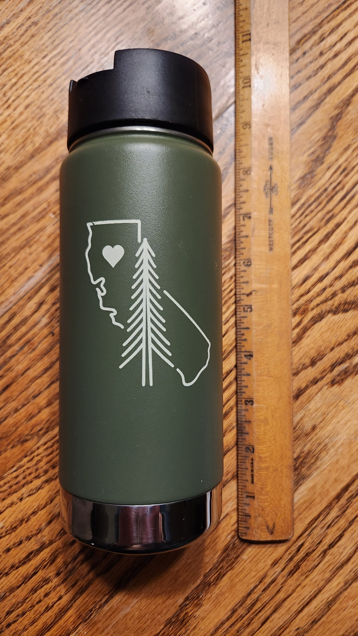 A green Klean Kanteen water bottle with a line drawing of California on it