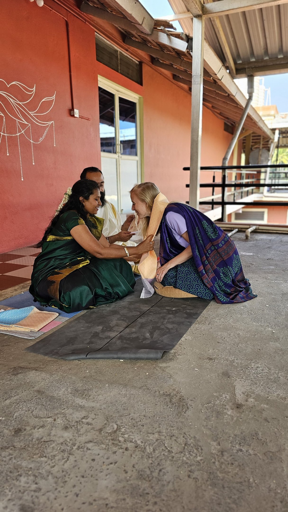 a woman in a green dress sitting on a bench