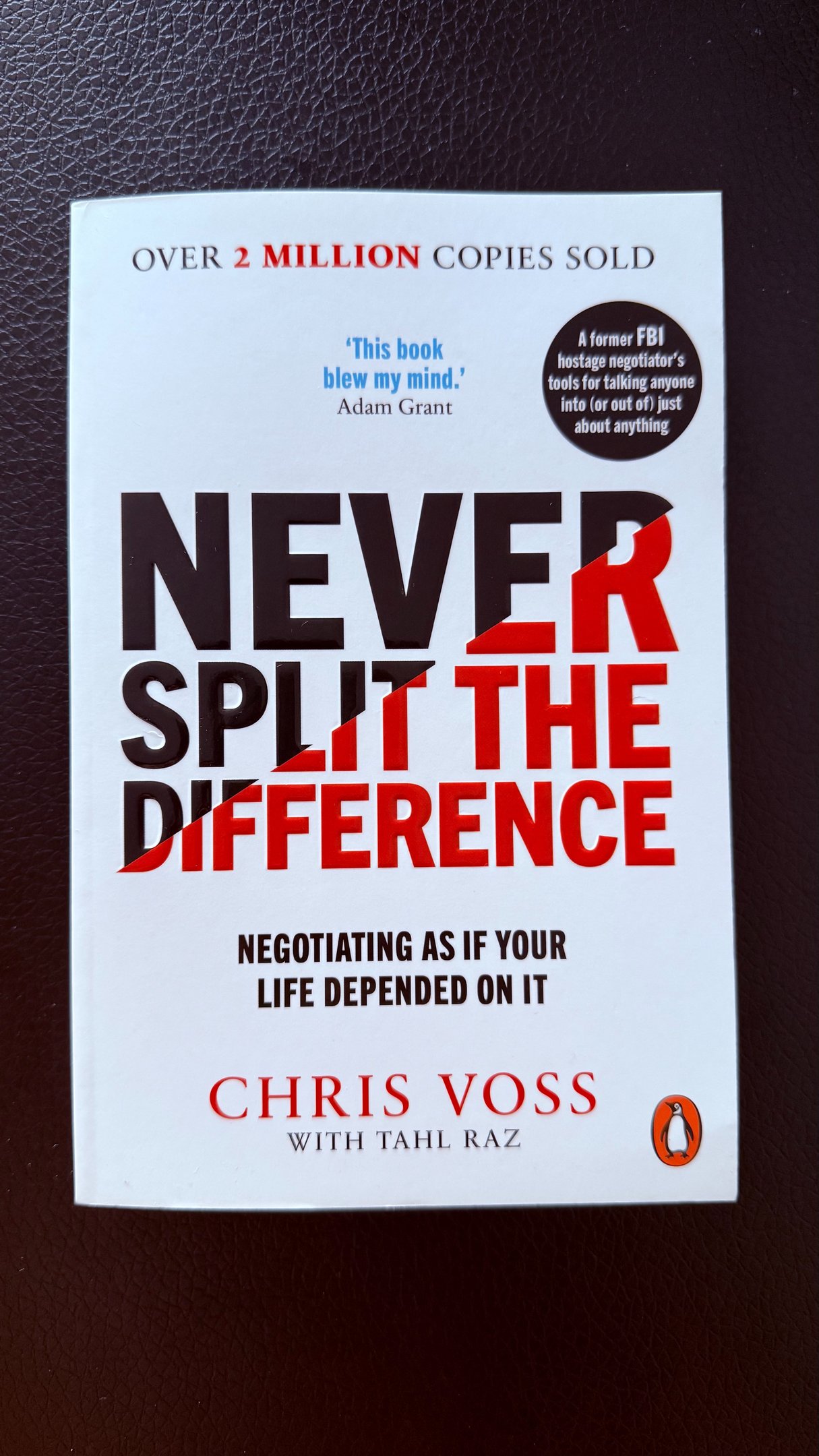a book cover of Never split the difference