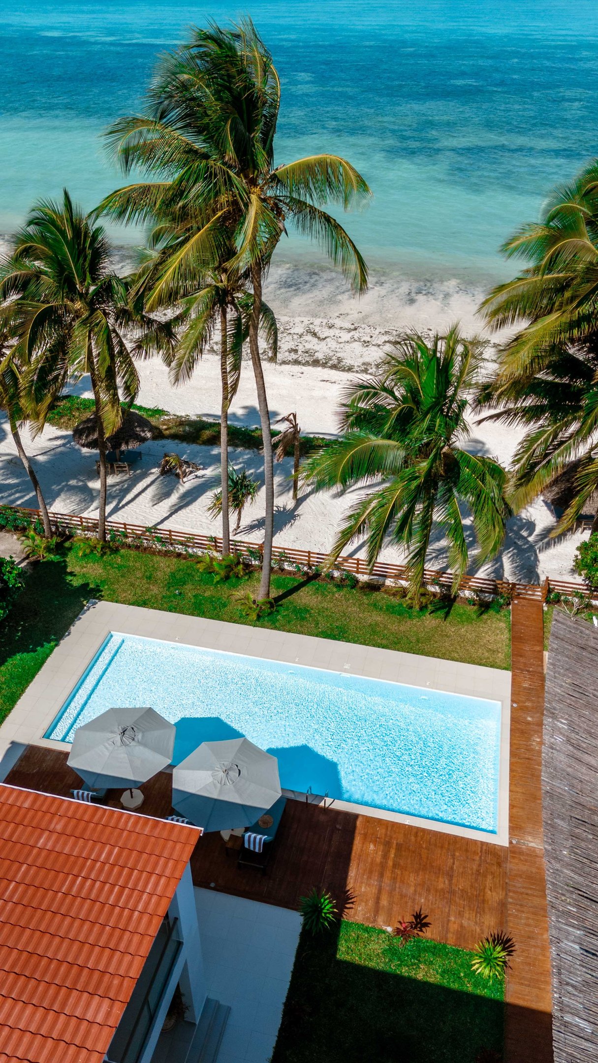 a pool with a view of the ocean, Villa serene Zanzibar 