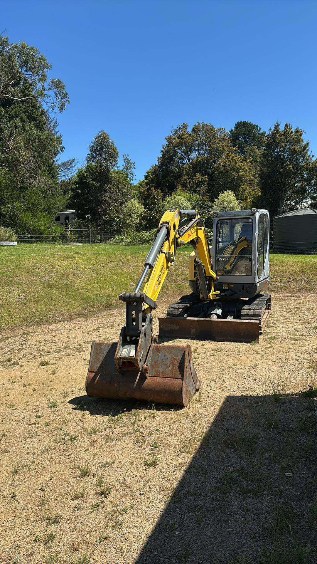 Compact 6 tonne Wacker Neuson excavator with digging buckets – used for test pits