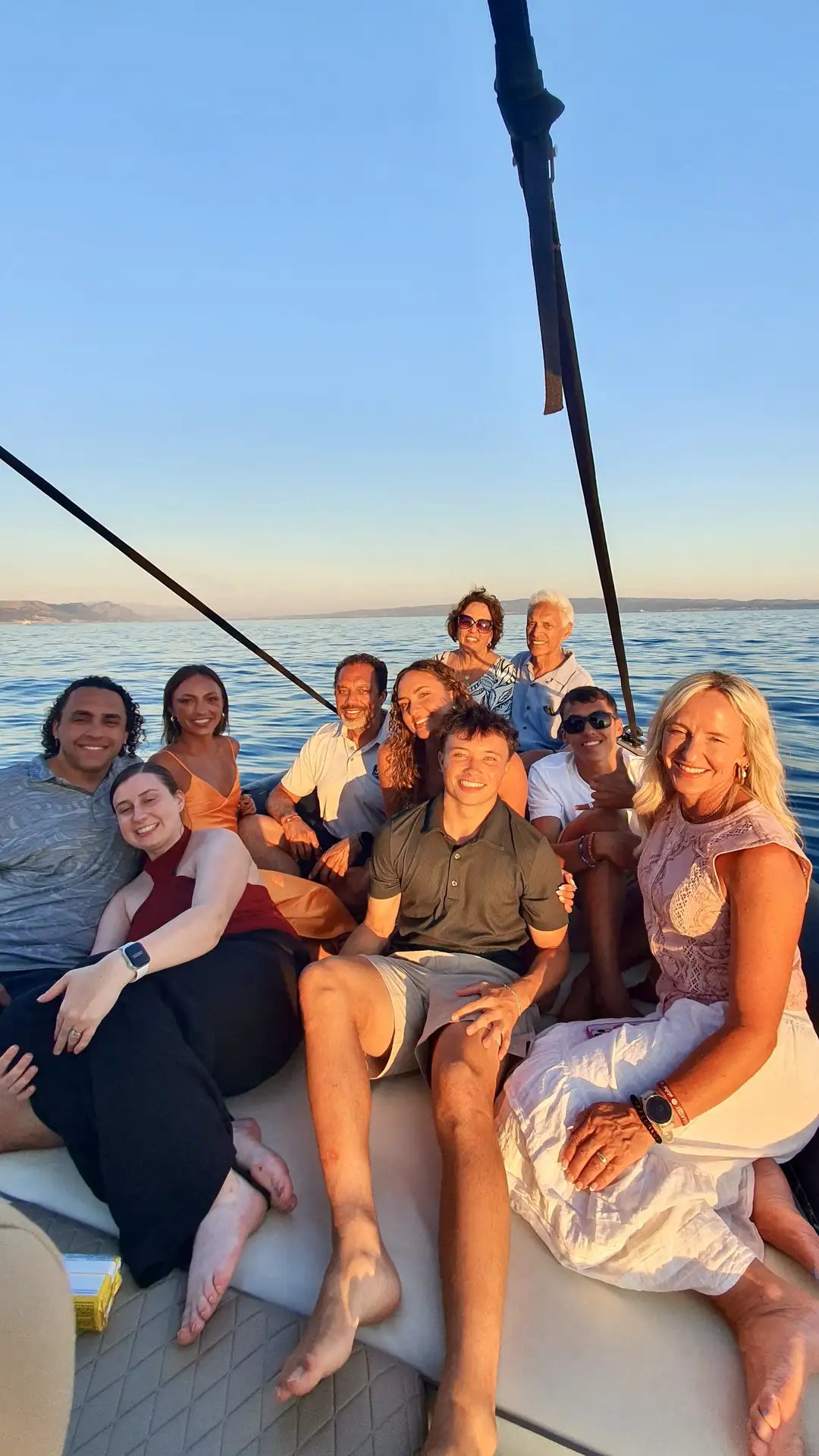 Large family posing together on a speedboat during a sunset boat tour in Split