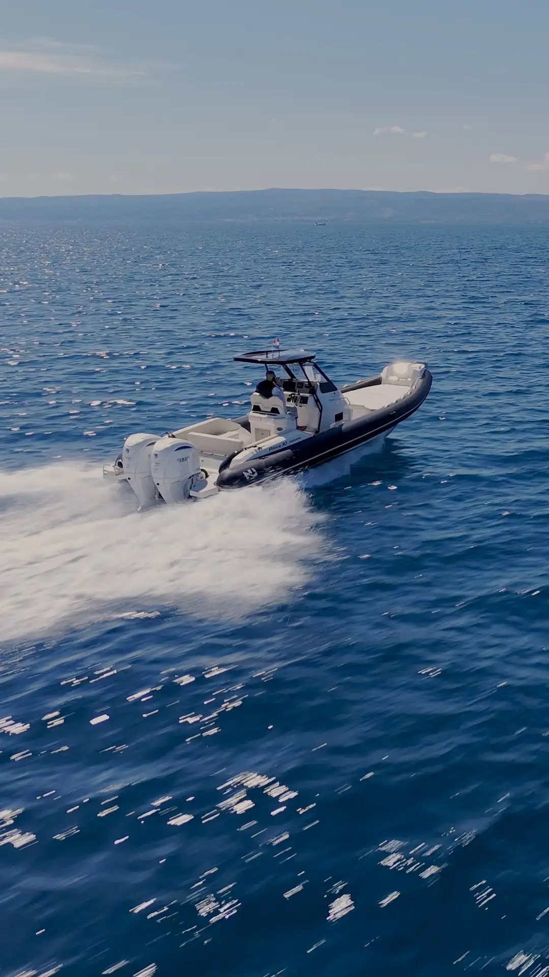 Drone view of Nuova Jolly Prince 30 Exclusive RIB slicing through the Adriatic Sea during a private boat transfer from Split
