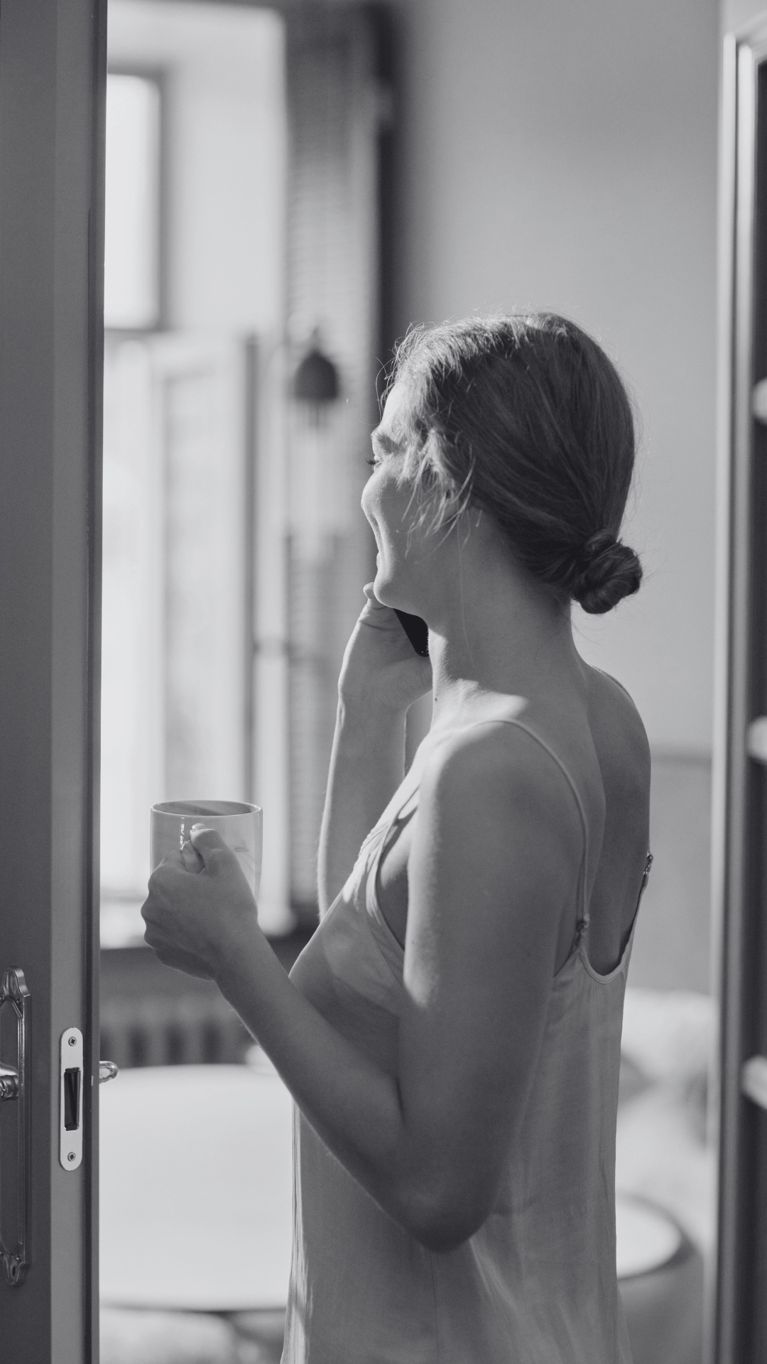A woman speaking on the phone to someone she is dating instead of texting.
