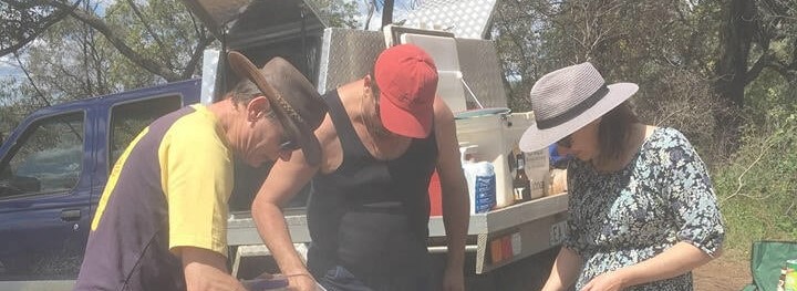 People cooking on a barbecue