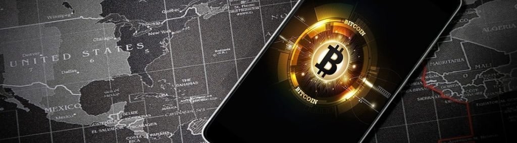 a smartphone with bitcoin on the screen