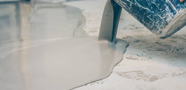 LAYTEX BEING POURED FROM A BUCKET