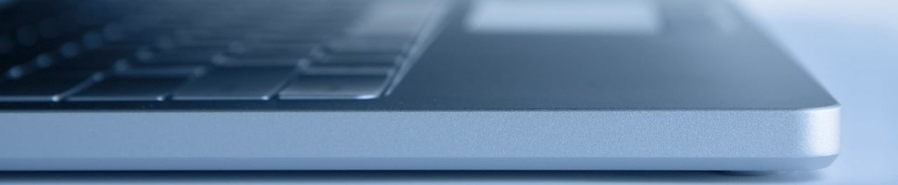 a laptop computer sitting on a table with a laptop