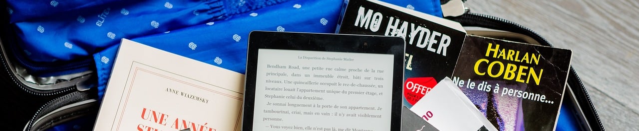 a suitcase with books and bookshelves in it