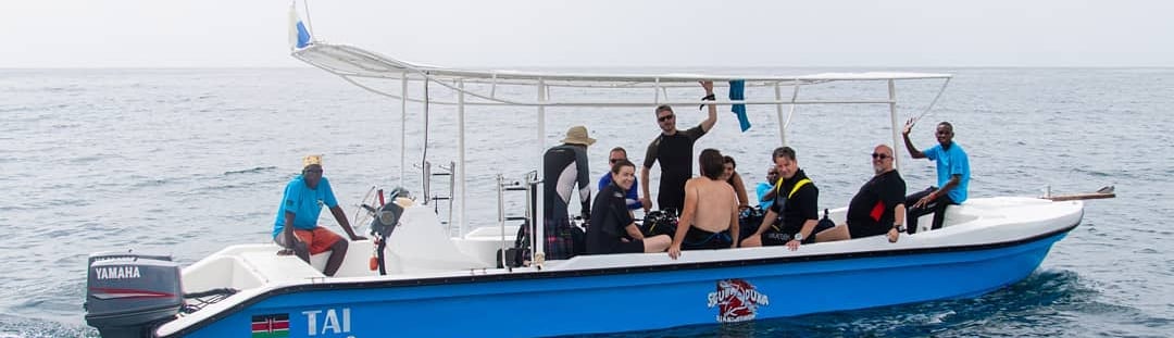 a group of people on a boat in the ocean