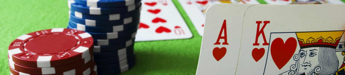 Ace and King of hearts, poker chips