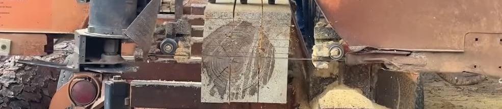 Wood-Mizer LT70 sawing lumber.