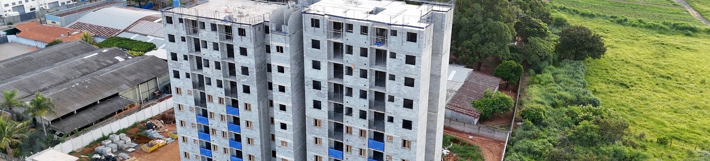 a tall building with a crane in the middle of it