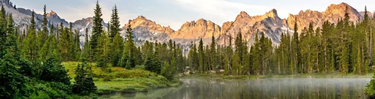 Mountains with a lake and pine trees in Idaho.