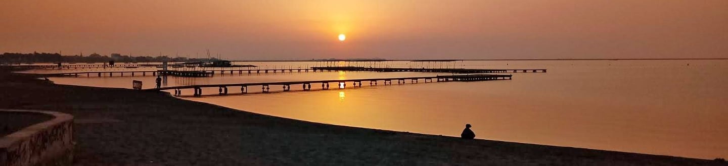 Dawn breaks in the coastal town of Santiago de la Ribera. Total calm usually reigns in the waters of