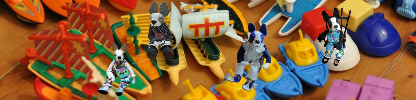 Boston Terriers  floating on boats.