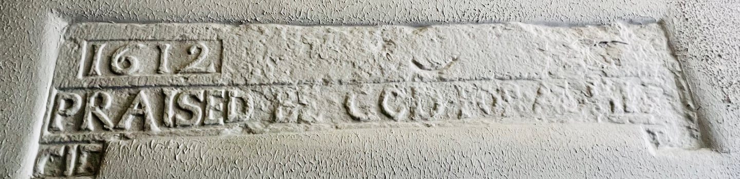 a 400 year old sign on the side of a wall