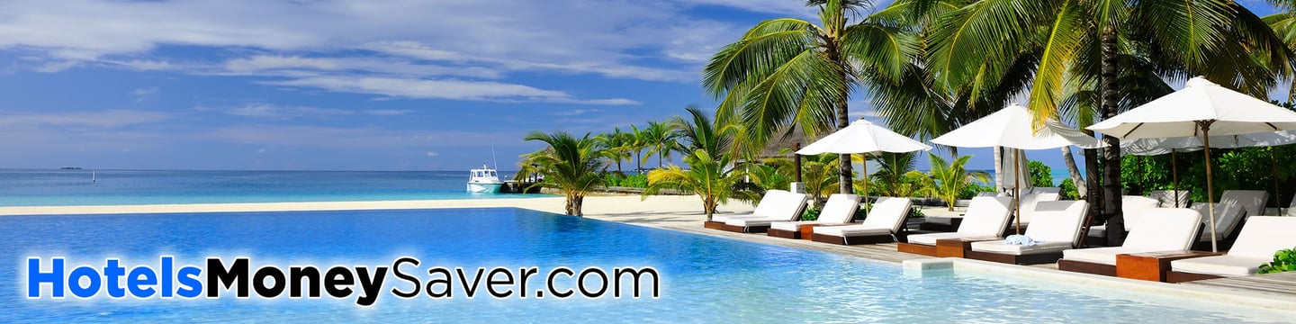 Beach Front Swimming Pool, Sunbeds, Parasols, with Palm Trees and Blue Sky