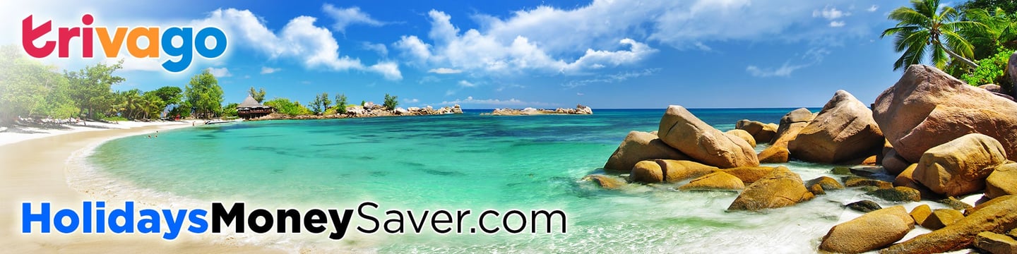Trivago on Perfect Beach with Golden Sand and Blue Sky, with Trees and Beach Huts in the Background