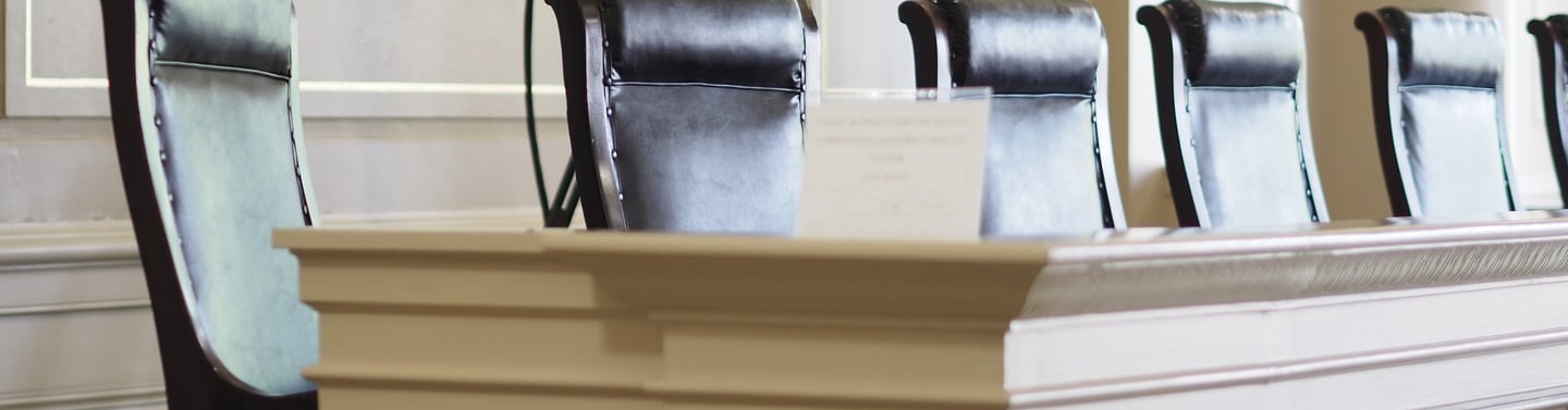 Arkansas Historic Supreme Court seats sit empty. This courthouse was established in 1836.