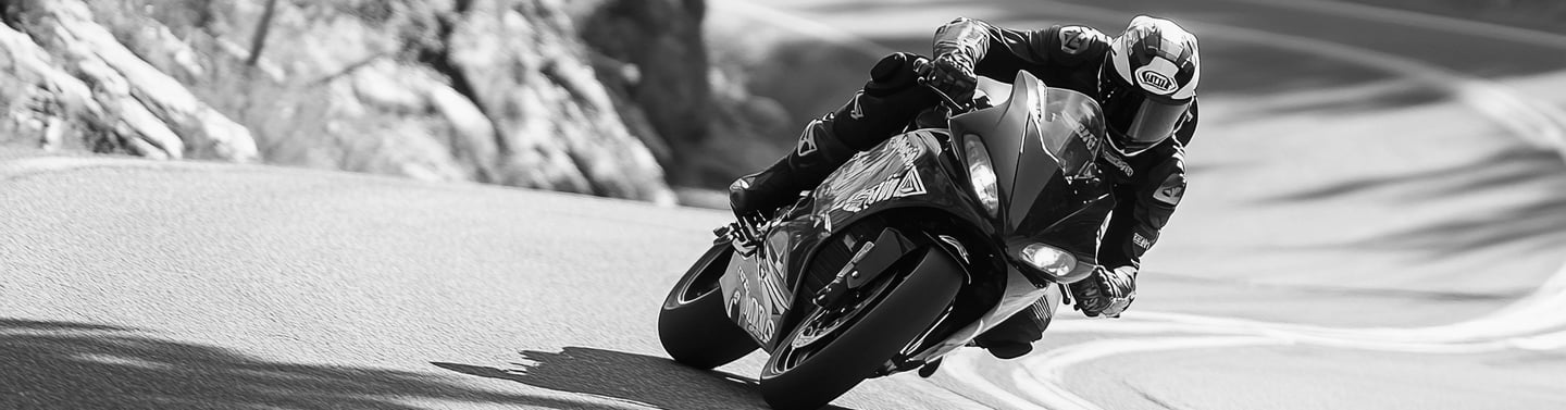 A motorcycle taking one of a number of corners