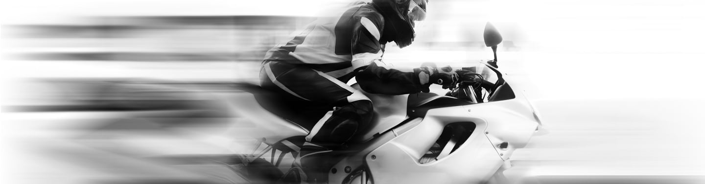 Blurred image of motorcycle to give illusion of speed