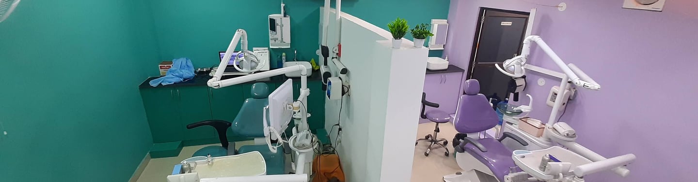 Clinical Work Area or Dental Operatory having 2 Dental Chairs connected to Sterilization Area