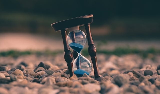 an hourglass indicating what to do when someone dies checklist