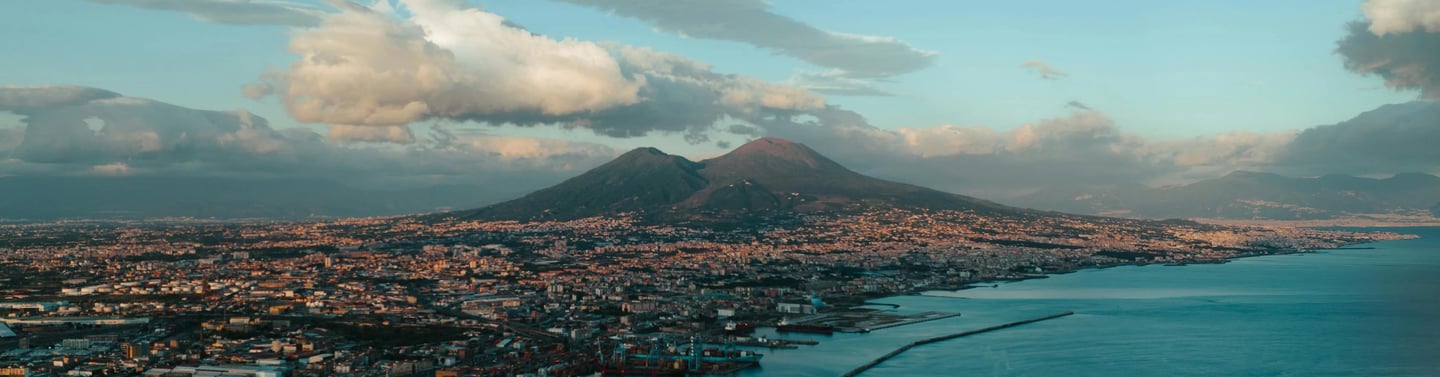 a view of Napoli with the Vesuvius in the background