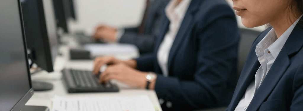 A warm office scene showing a small team of professionals collaborating over financial documents.